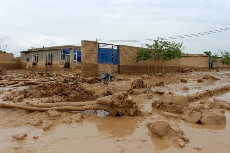 A man stands in the mud after a flash flood in Baghlan, Afghanistan, on Saturday. Photo by Samiullah Popal/EPA-EFE