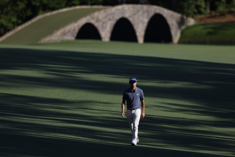 Collin Morikawa walks on the 13th-hole fairway with the iconic Ben Hogan Bridge in the background on the final day of the 2024 Masters Tournament at Augusta National Golf Club, whose former warehouse worker on Wednesday admitted to stealing millions of dollars worth of artifacts and merchandise. File Photo by John Angelillo/UPI