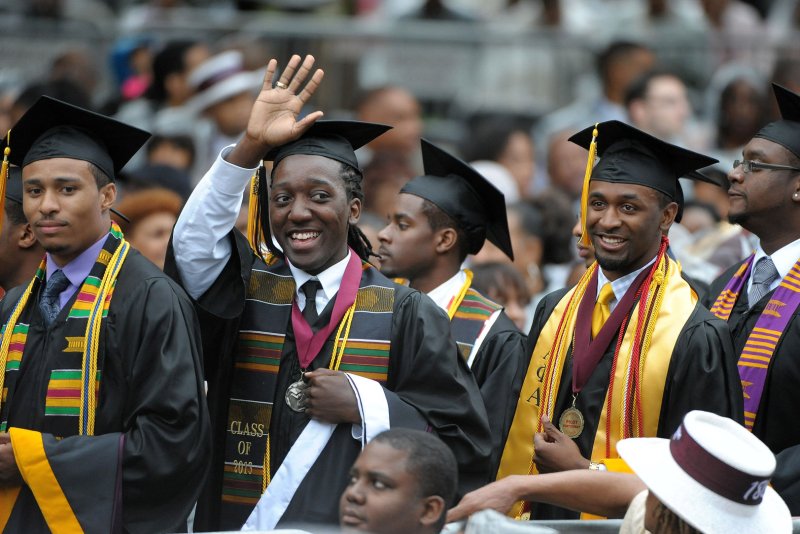 Morehouse College graduating seniors wave to family members before President Barack Obama delivers their commencement address on May 19, 2013, in Atlanta. Total investments in HBCUs has brought the total to $16 billion. UPI/David Tulis