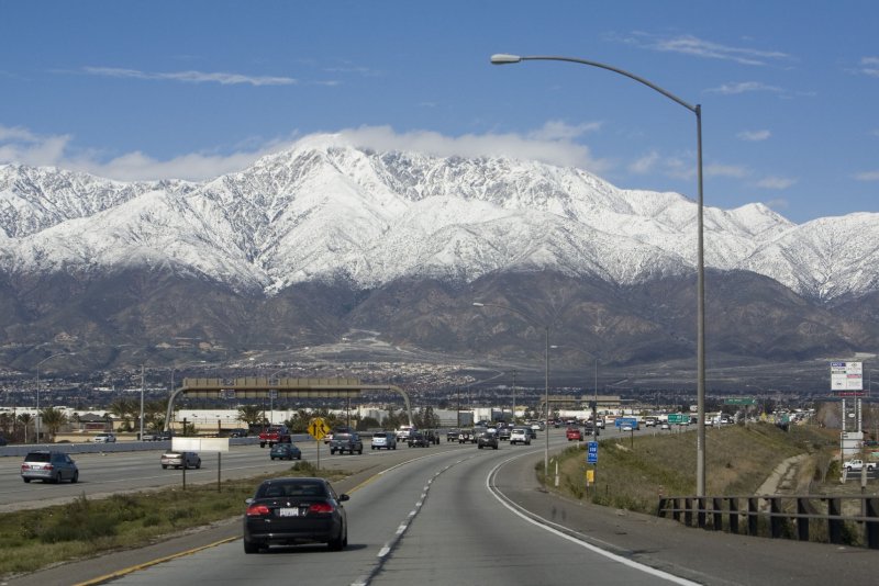 The snow capped San Gabriel Mountains are seen looking north from the Interstate 10 and 15 interchange in Ontario, Calif. Photo by Terry Schmitt/UPI