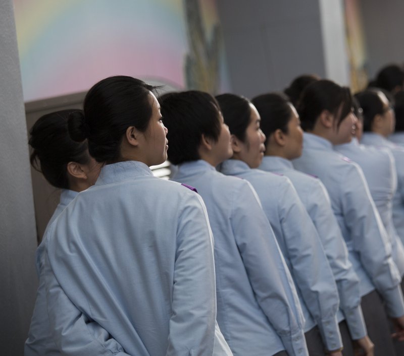 Female adults prisoners at the Lo Wu Correction Institution (LWCI) line up to receive their certificates in vocational training during an award ceremony at the medium security Chinese institution in Hong Kong, March 2013. The Coalition for Women in Journalism on Monday afternoon put on social media how they are “very concerned” over Zhang’s whereabouts. Photo by Jerome Favre/EPA