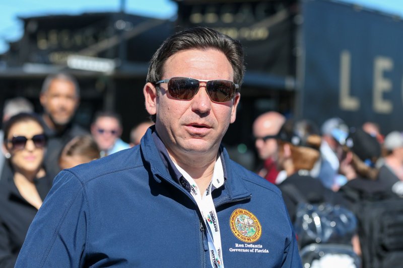 Florida Gov. Ron DeSantis walks through the garage area before the 66th Annual Daytona 500 at the Daytona International Speedway on February 19. DeSantis declared a state of emergency for a dozen counties in northern Florida because of storms this weekend. File Photo by Mike Gentry/UPI