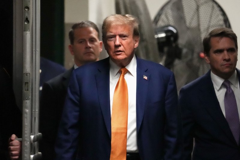 Former President Donald Trump arrives for his trial at Manhattan criminal court in New York on Tuesday. It is the fourth week of the hush-money trial of Trump, who faces charges for allegedly falsifying business records to cover up a sex scandal during his 2016 presidential campaign. Pool photo by David Dee Delgado/UPI