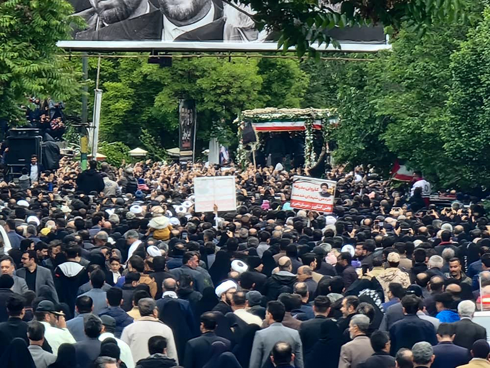 People attend a funeral ceremony for Iranian President Ebrahim Raisi and his senior officials on Tuesday