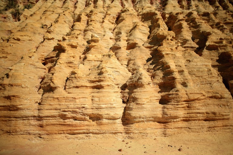 A mine dump of fine sand, the residue of crushed rock from deep mining, is eroded by the elements on July 15, 2013 in Johannesburg, South Africa. Johannesburg became the centre of gold mining in 1886 when gold was first discovered. Two government officials were sent to establish a settlement and named it Johannesburg after the first name they both shared. The gold rush lasted for over 100 years. The South African mining industry has shed more than 340,000 jobs since 1990 but is still the fifth largest gold producer in the world and has vast amounts of other minerals still to be unearthed.. (Photo by Christopher Furlong/Getty Images)