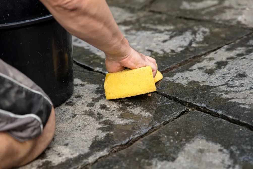 Trevor recommends scrubbing the patio by hand with soapy water