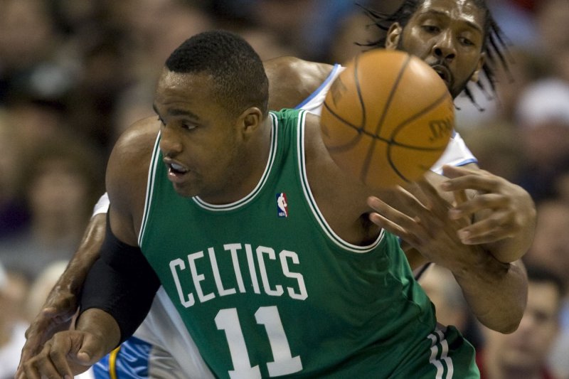 Denver Nuggets center Nene (R) tips the ball away from Boston Celtics forward Glen Davis during the first quarter at the Pepsi Center on February 21, 2010, in Denver. File Photo by Gary C. Caskey/UPI