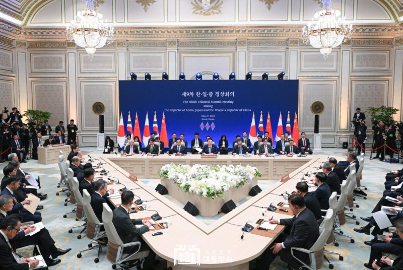 North Korea issued a response to a trilateral summit between South Korea, Japan and China on Monday, warning that any efforts to interfere with its nuclear weapons program would lead to "hastened war." Photo courtesy of South Korean President's office