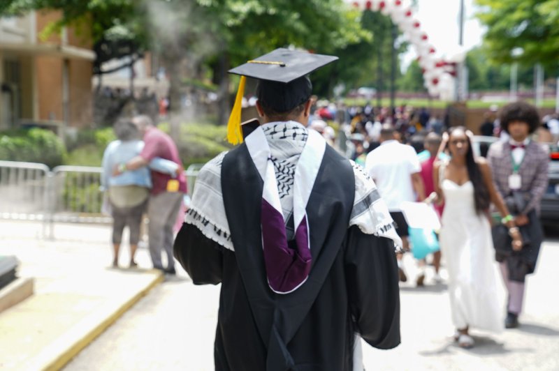 A graduate wearing a Palestinian keffiyeh leaves the 140th Morehouse College commencement exercises on Century Campus at Morehouse College in Atlanta, Ga., on May 19. New research shows many Americans today question the value of a four-year degree. Photo by Megan Varner/UPI