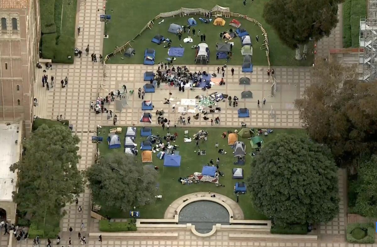 Aerial view of a bordered encampment on a college campus.