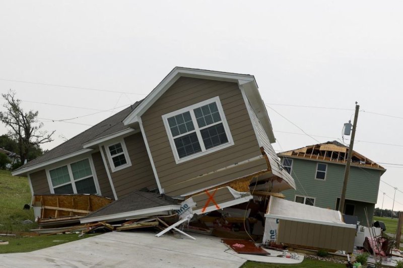 A general view of a house leaning on its side after being hit by a tornado in Temple, Texas on Thursday. Severe storms are moving East for Memorial Day, forecasters said on Monday. Photo by Adam Davis/EPA-EFE