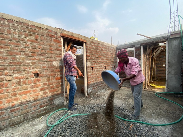 Sidhant Mende overseeing the construction of a small house in Ralegaon. His engineering degree, he says, has not helped him at all in securing a job [Al Jazeera/Kunal Purohit]