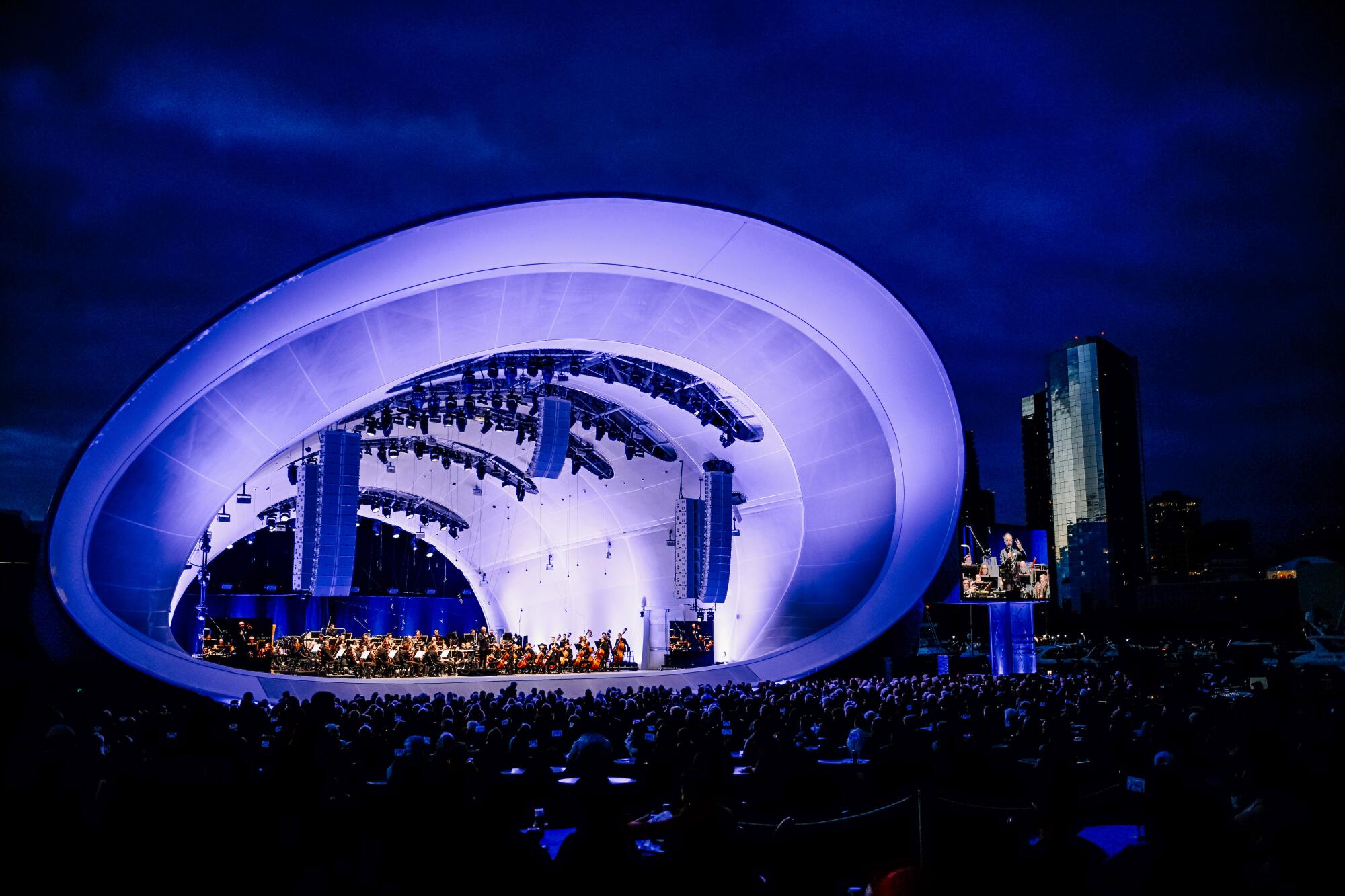 Symphony goers watch a performance of the San Diego Symphony at the Rady Shel.