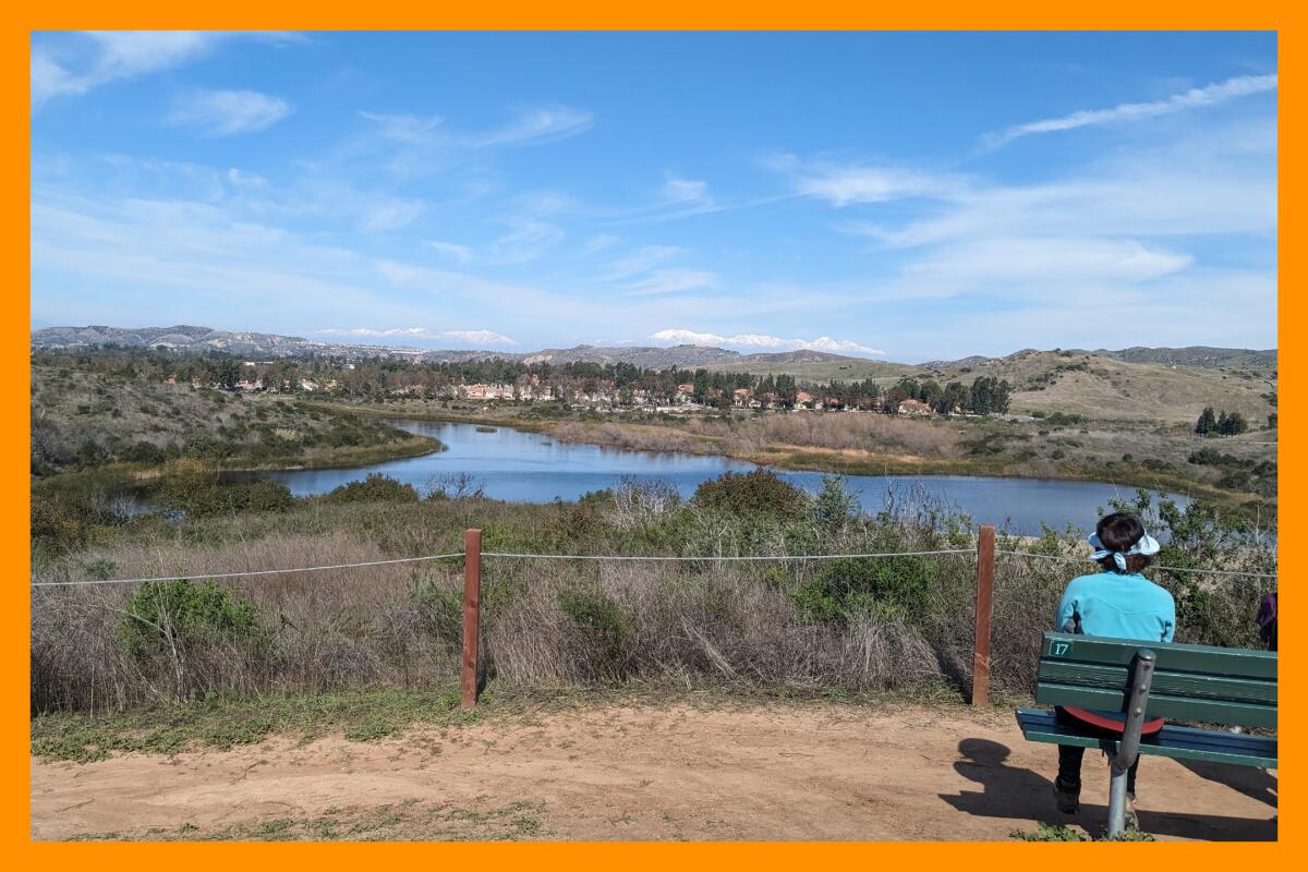 A hiker takes a break along Lake View Trail in Peters Canyon.