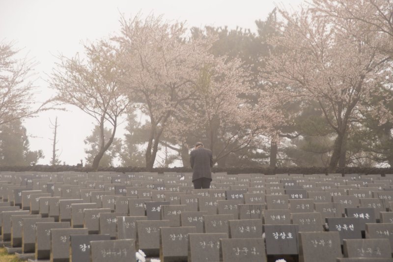 A man pays his respects during the 76th anniversary of the Jeju 4.3 memorial ceremony at the Jeju 4.3 Peace Park in Jeju City, South Korea, on April 3, 2024. A moment aimed at securing an apology from the United States over its involvement in the massacre was discussed Wednesday during the Jeju Forum for Peace and Prosperity. Photo by Darryl Coote/UPI