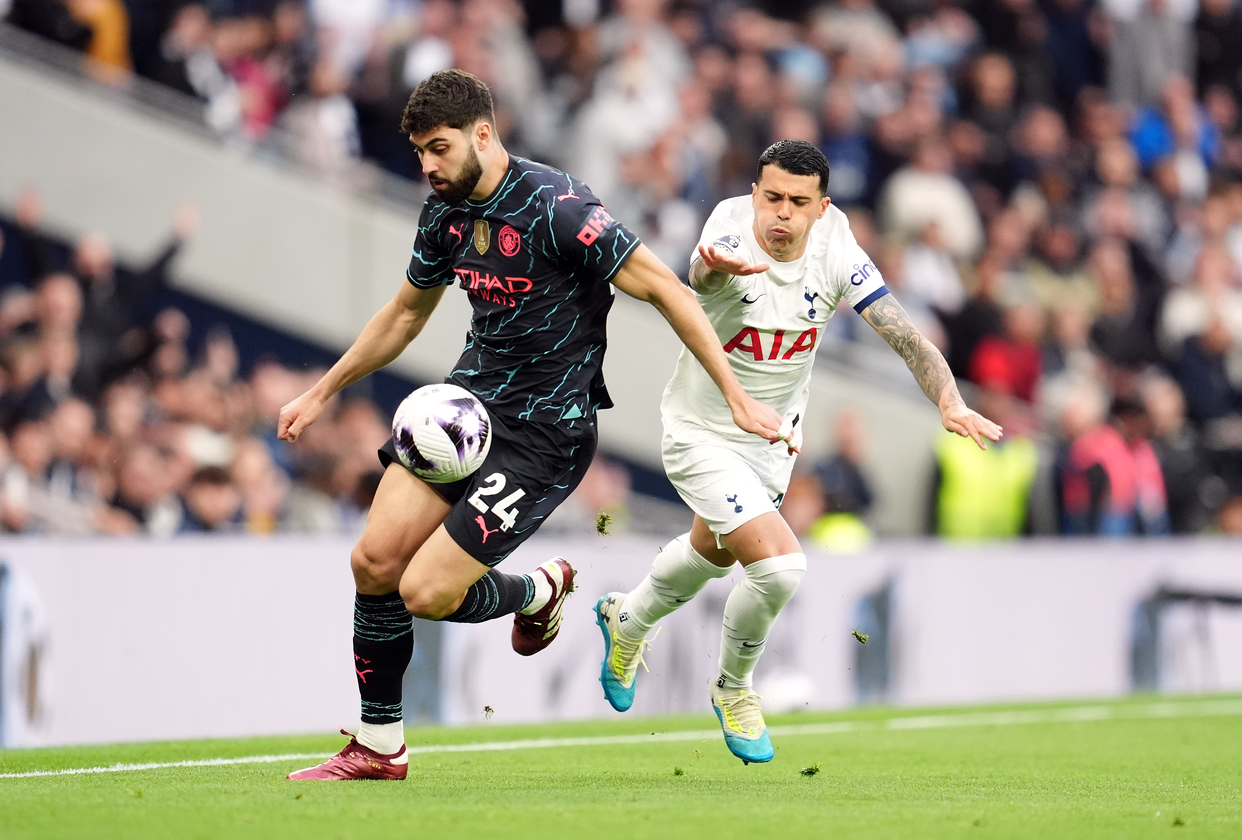 Man City’s Josko Gvardiol fends off Pedro Porro in the crucial Perm game