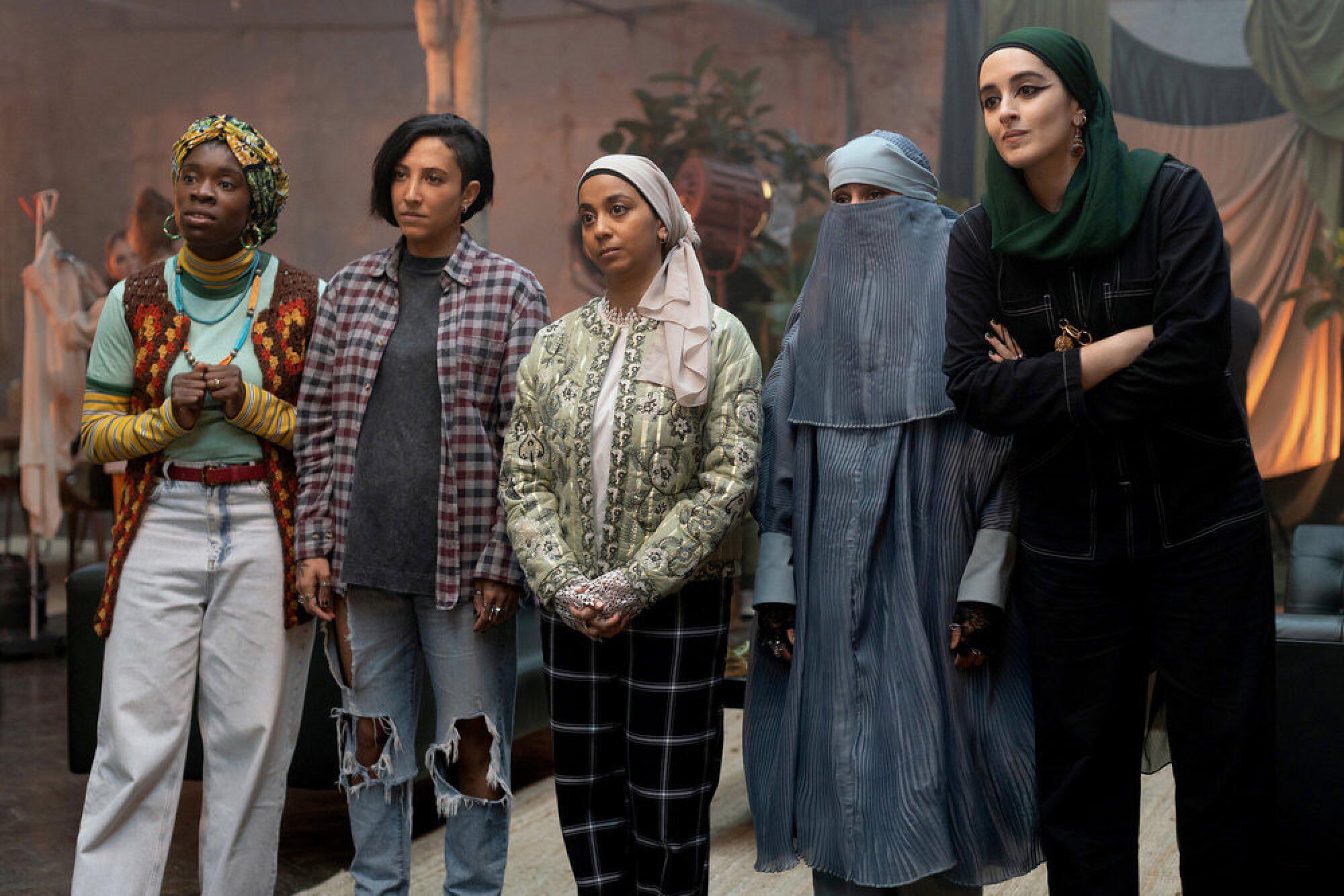 A group of women standing side by side.