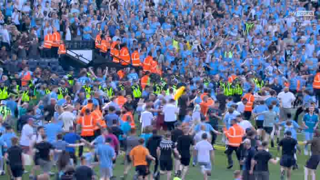 Man City fans storm the pitch after it was confirmed they'd won a FOURTH Premier League title in a row