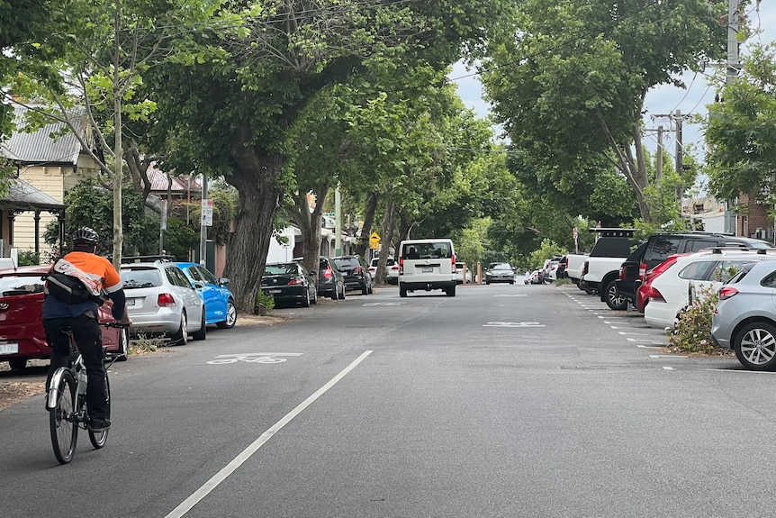 Parked cars line the streets of inner city Melbourne suburbs.