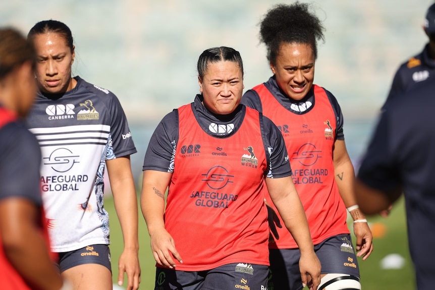 female rugby players on field 