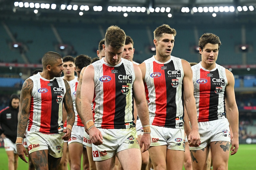 St Kilda walk off the MCG following its AFL loss to Melbourne.