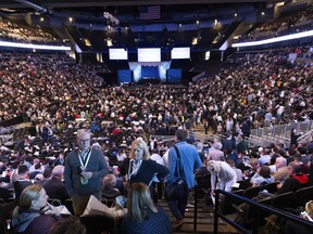 Harold and Caroline Ernst of St. Louis chat with fellow shareholders as they wait for the Berkshire Hathaway annual meeting to begin on Saturday, May 4, 2024, in Omaha, Neb.