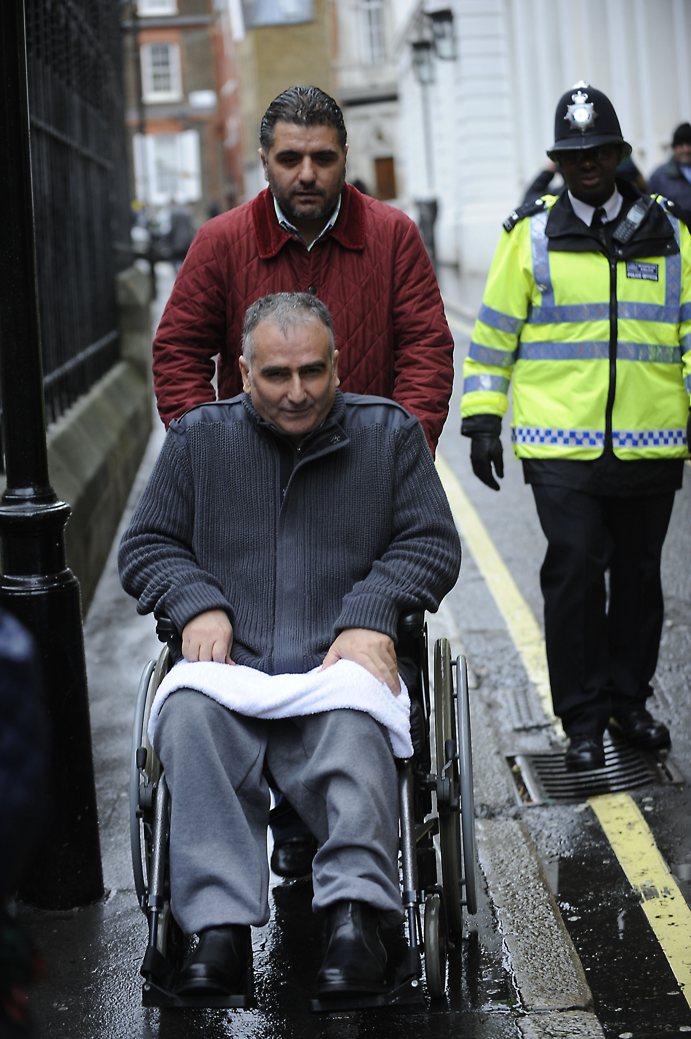 Abdullah Baybasin, above in wheelchair, was seen in a Barcelona restaurant last month with drug lord Tekin Kartal, who was shot dead soon after leaving