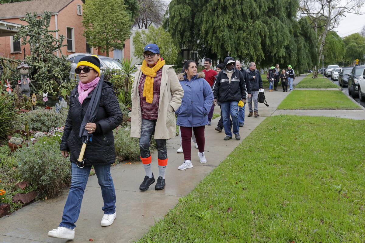 A group of people assist the Reclaimers move into an empty Caltrans-owned home in March 2020.