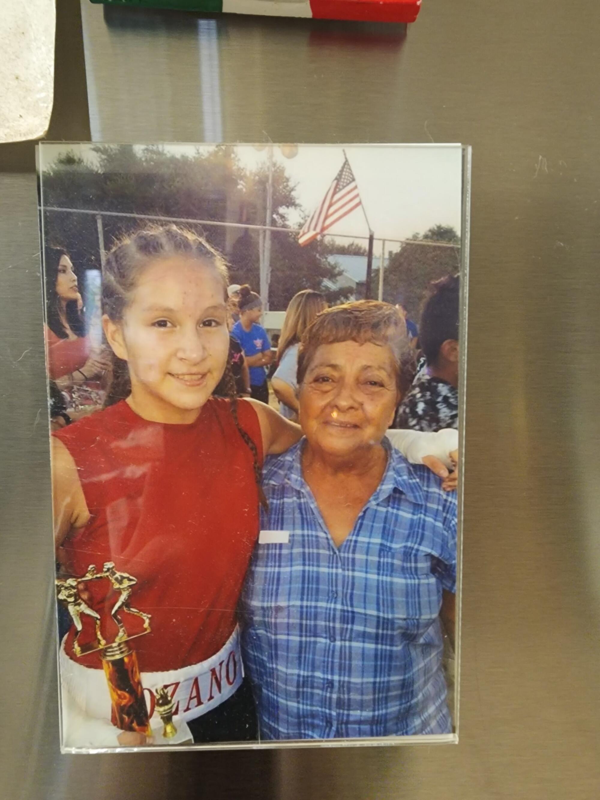 Jennifer Lozano, left, stands next her grandmother, Virginia Sánchez Cuevas, who was killed in a shooting in 2017.