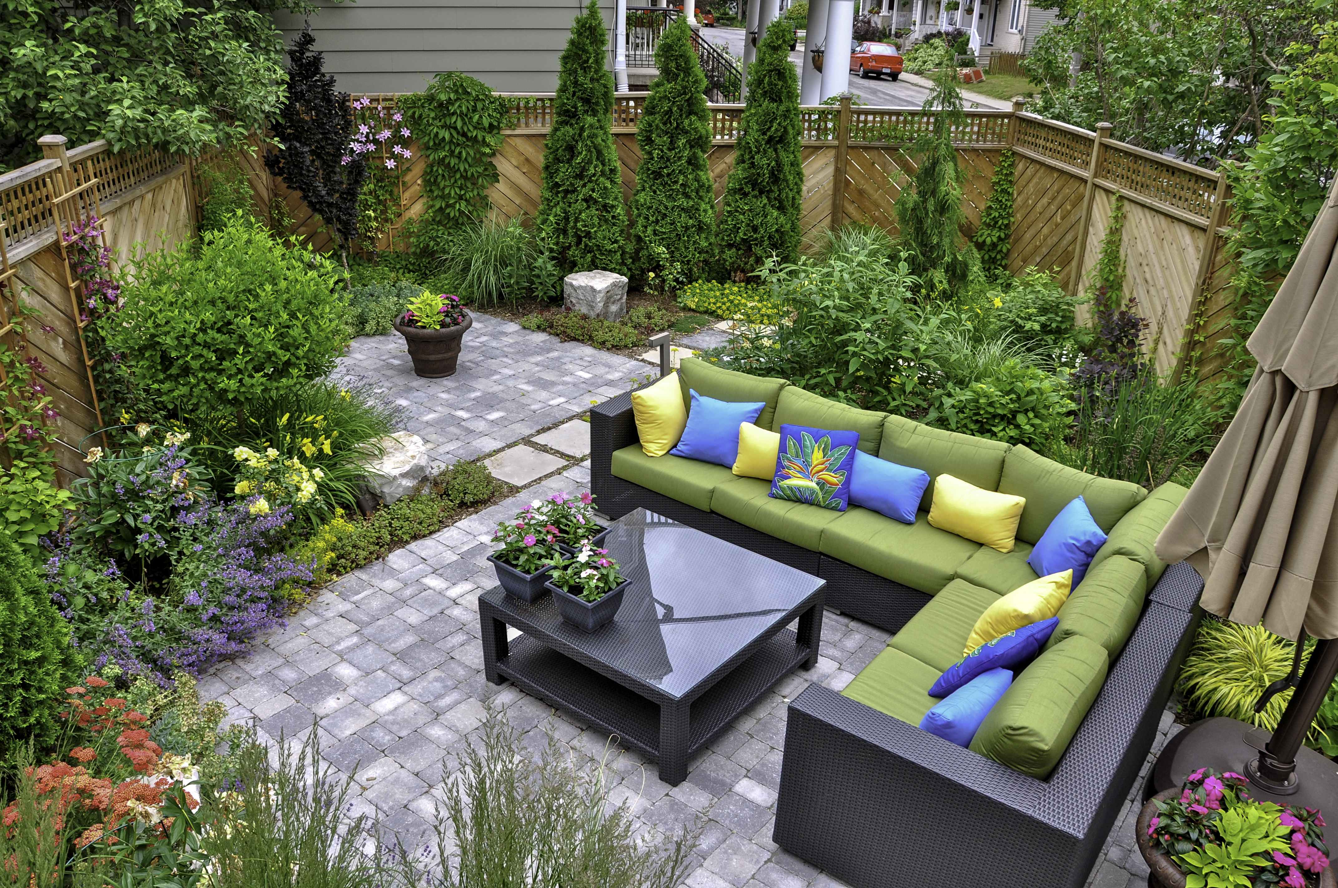 Decking your backyard with stylish furniture adds an inviting touch