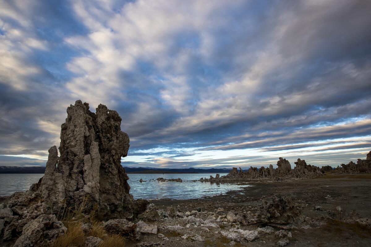 Passing clouds provide a striking backdrop for exposed tufa towers along the shore of Mono Lake in Lee Vining.