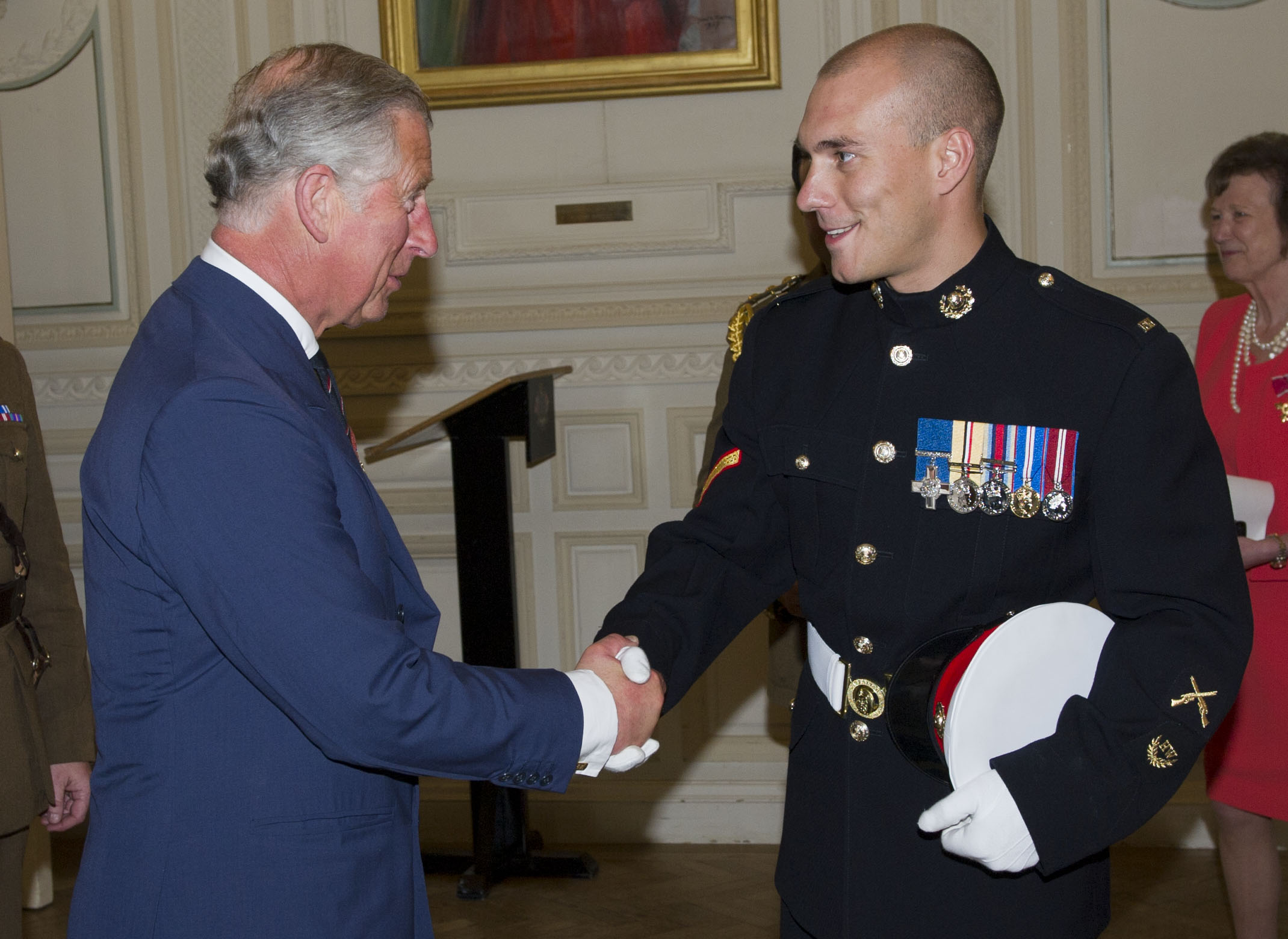 Croucher shaking hands with King Charles