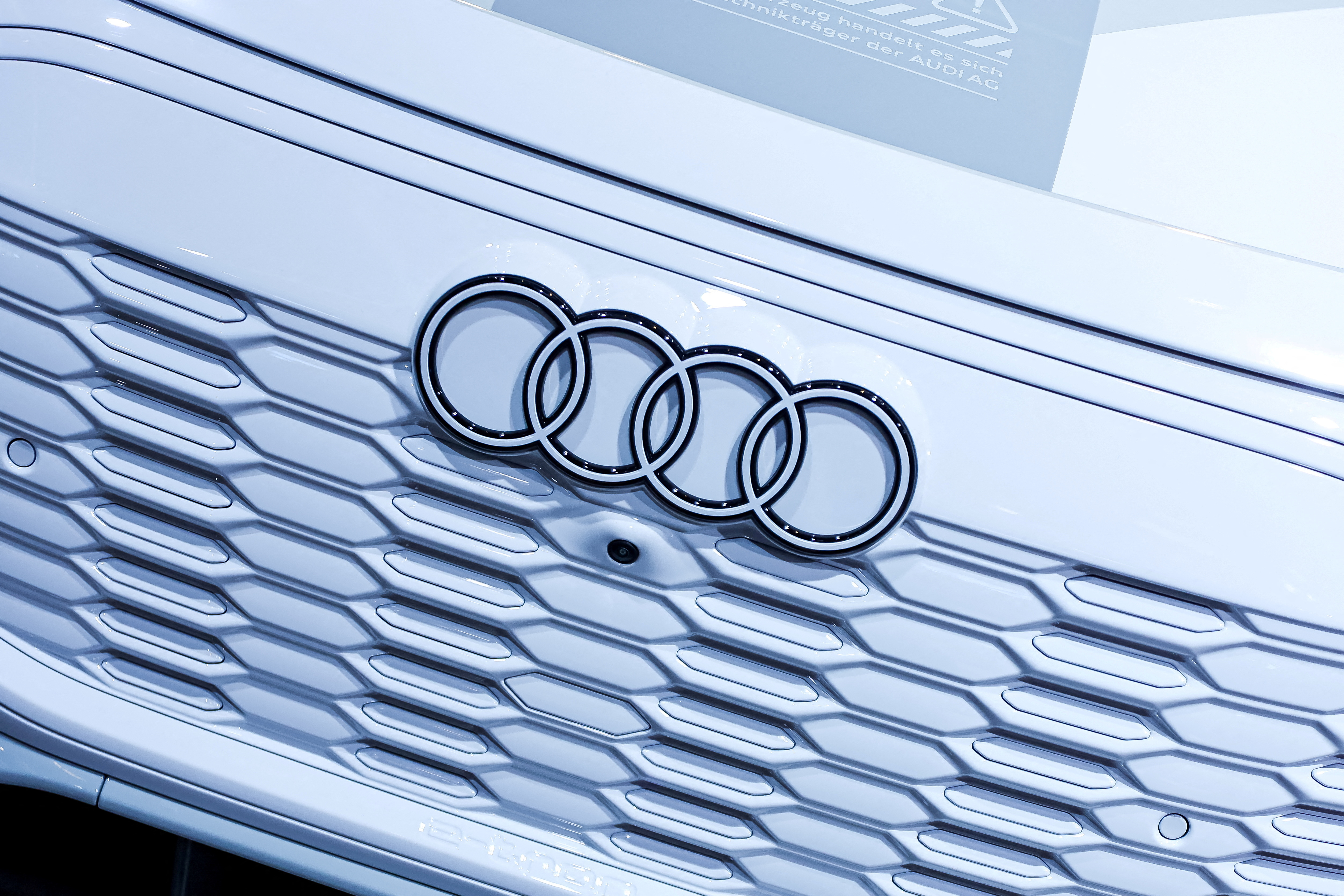 The four circles overlapping represent the merging of brands Audi, DKW, Horch and Wanderer