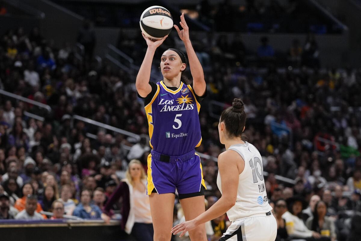 Sparks forward Dearica Hamby shoots over Las Vegas Aces guard Kelsey Plum during the second half Sunday.