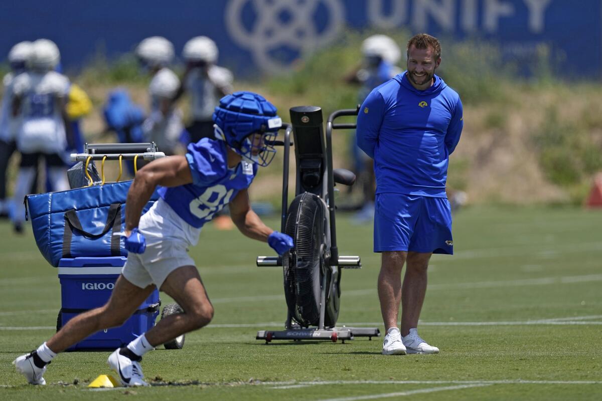 Rams receiver JJ Laap runs a drill as head coach Sean McVay watches during a practice at Cal Lutheran.