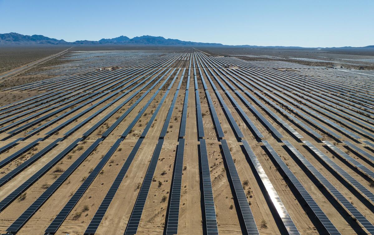 Metal rows on a desert floor.