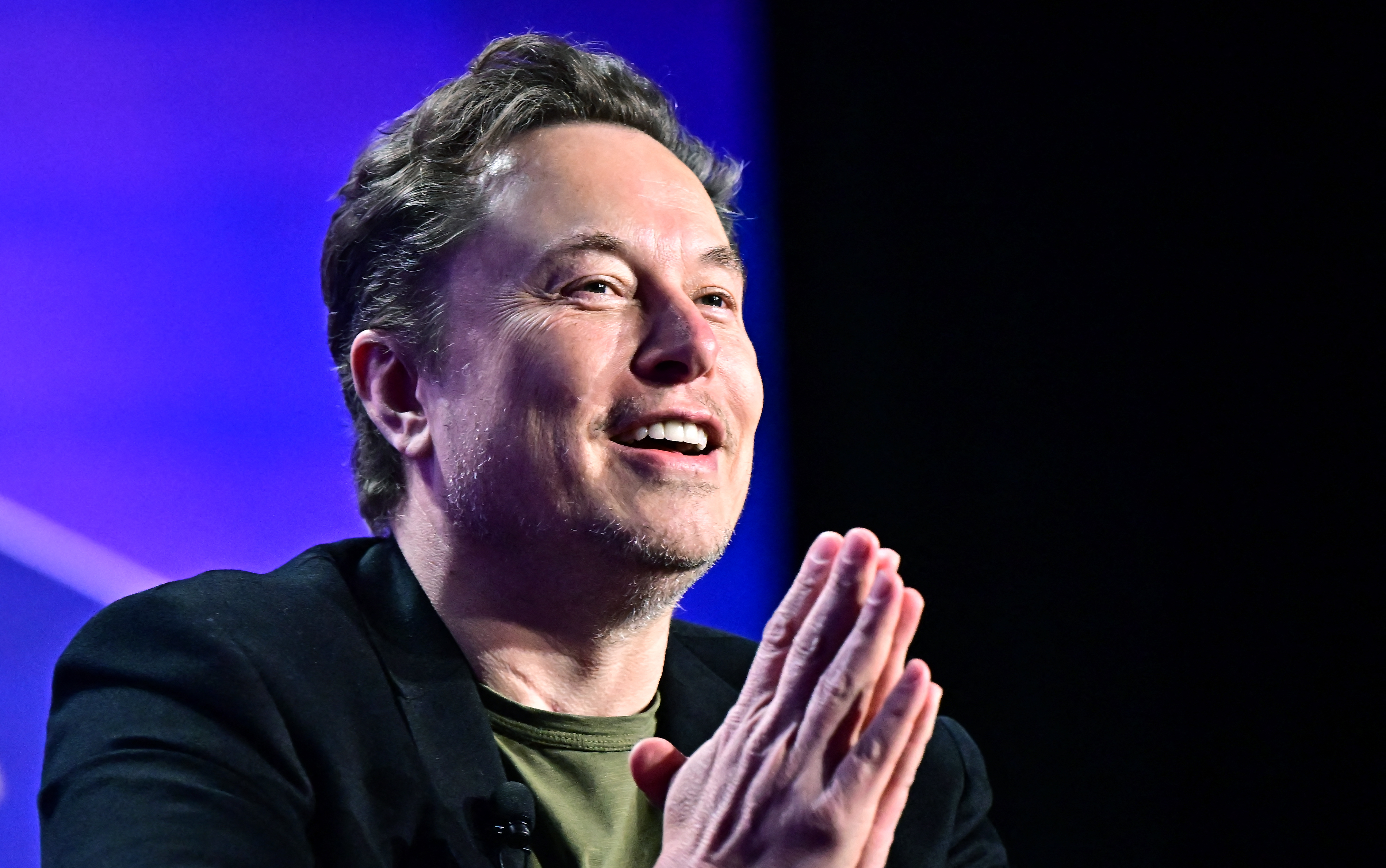 The beaming Tesla chief executive declared his love for all the stakeholders who helped him get the pay boost