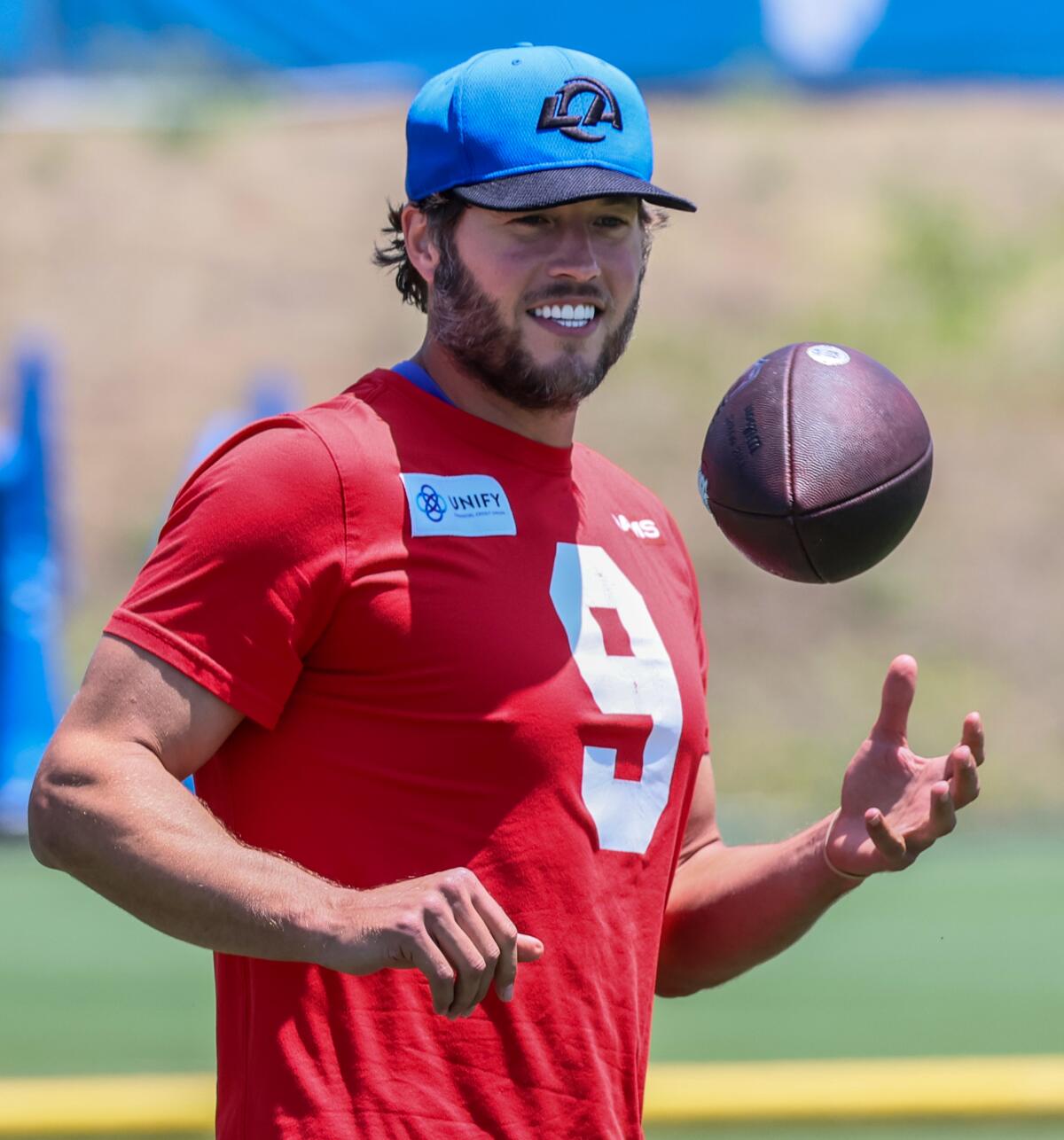 Rams quarterback Matthew Stafford flips a football during their final OTA practice at Cal Lutheran University.