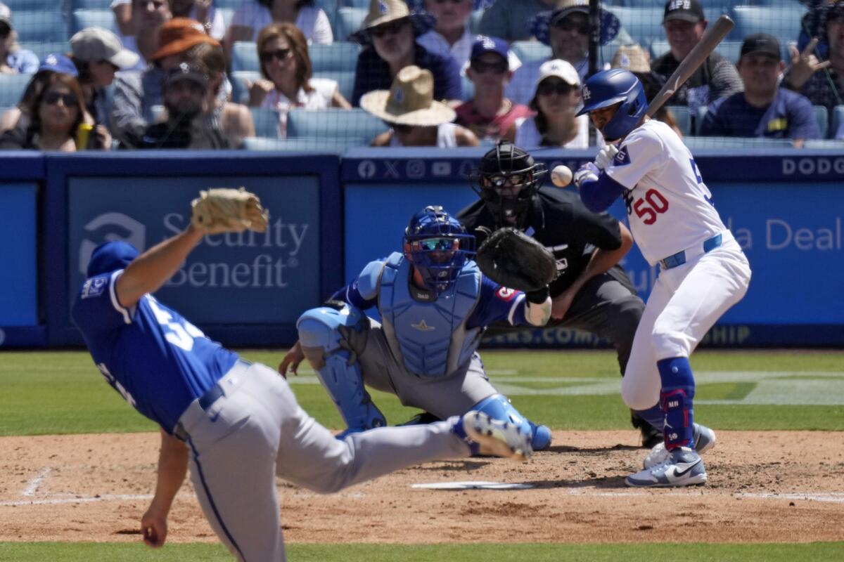 Mookie Betts is hit by a pitch during the seventh inning Sunday against the Royals at Dodger Stadium.