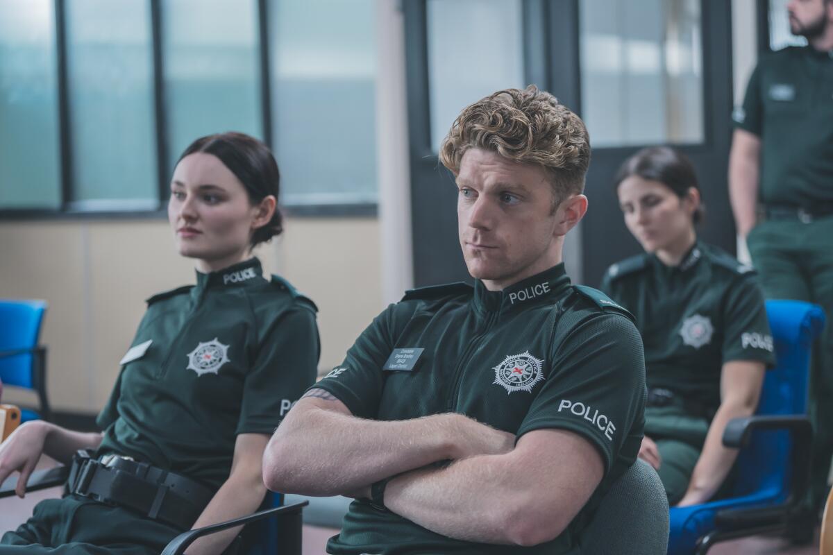 Policemen and women in a department meeting.