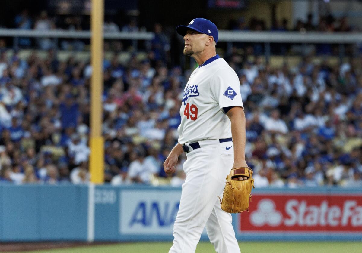 Dodgers pitcher Blake Treinen reacts after giving up a grand slam to Kansas City's MJ Melendez.