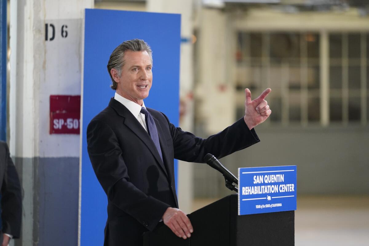 Gov. Gavin Newsom speaks at a podium.