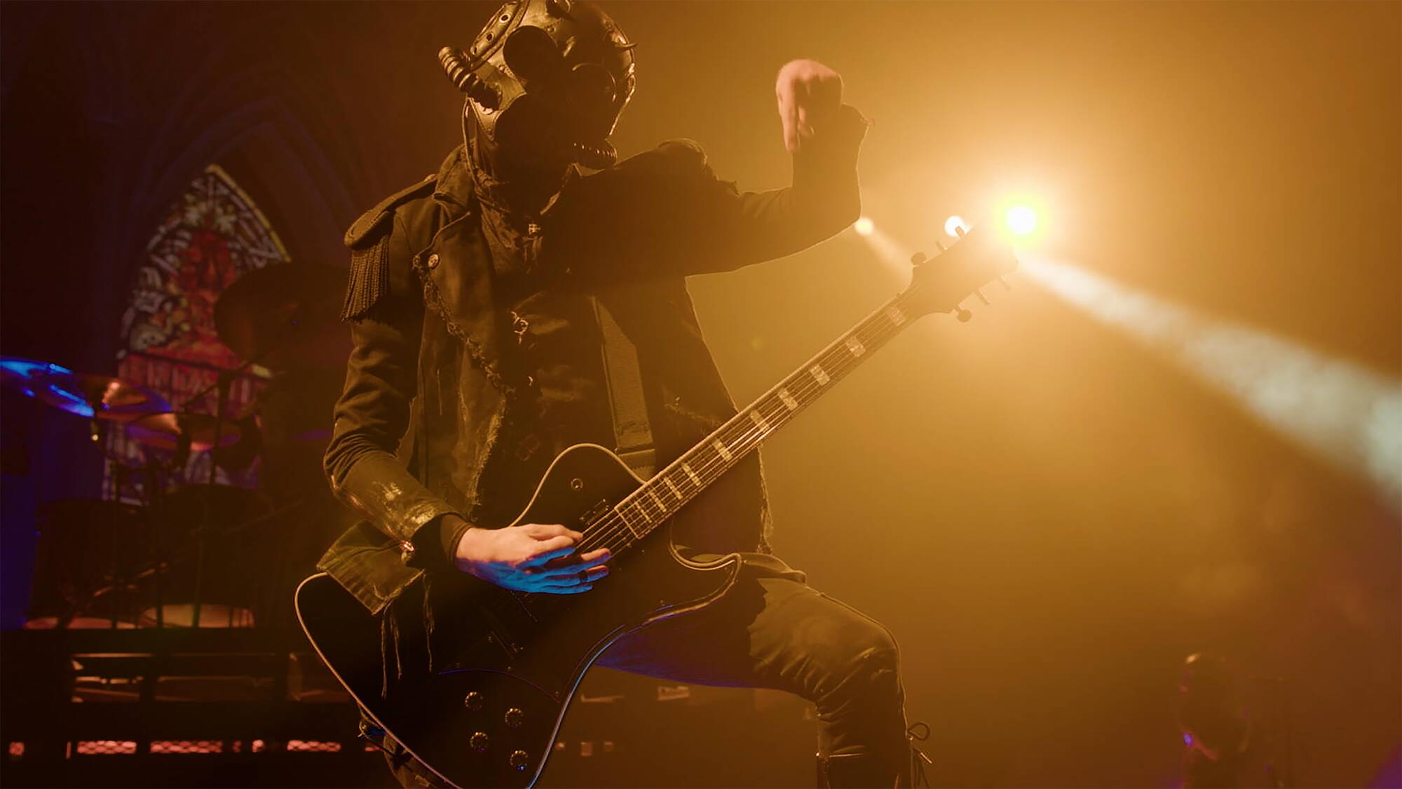 A metal guitarist shreds onstage.