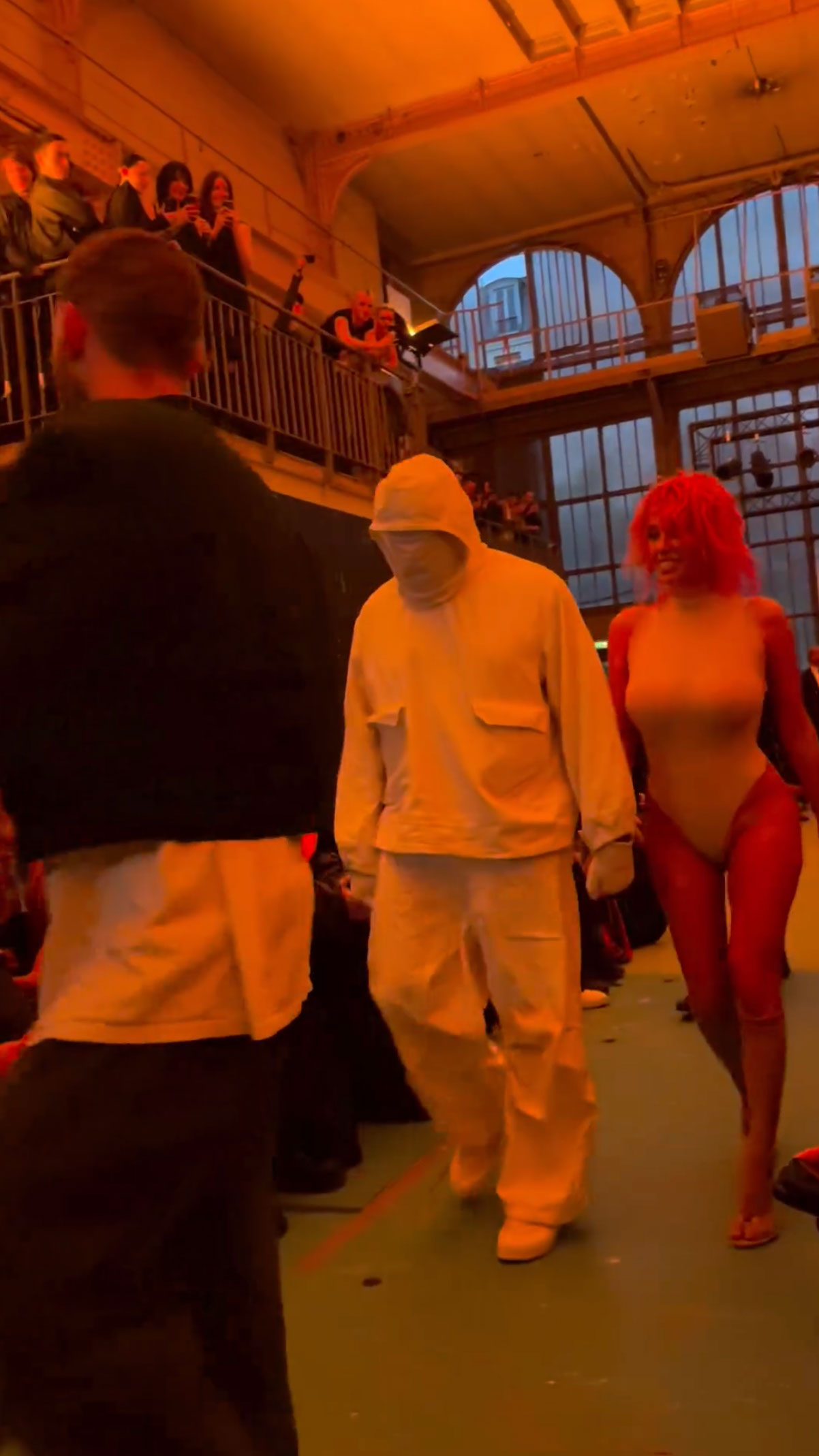 Kanye wore an all-white attire including a sweatshirt, pants, and shoes