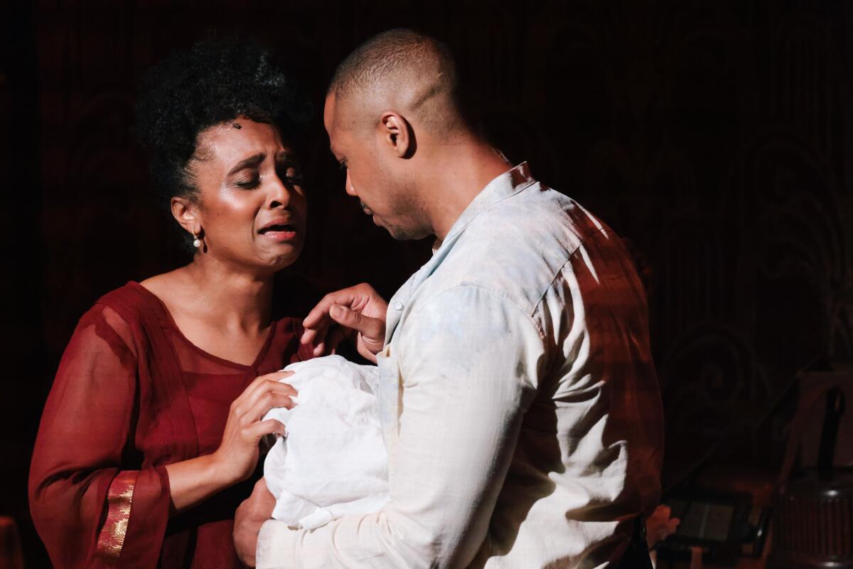 Lindsay Patterson Abdou cries as Nellie and Davóne Tines, as Jim, holds his baby in "The Comet / Poppea."