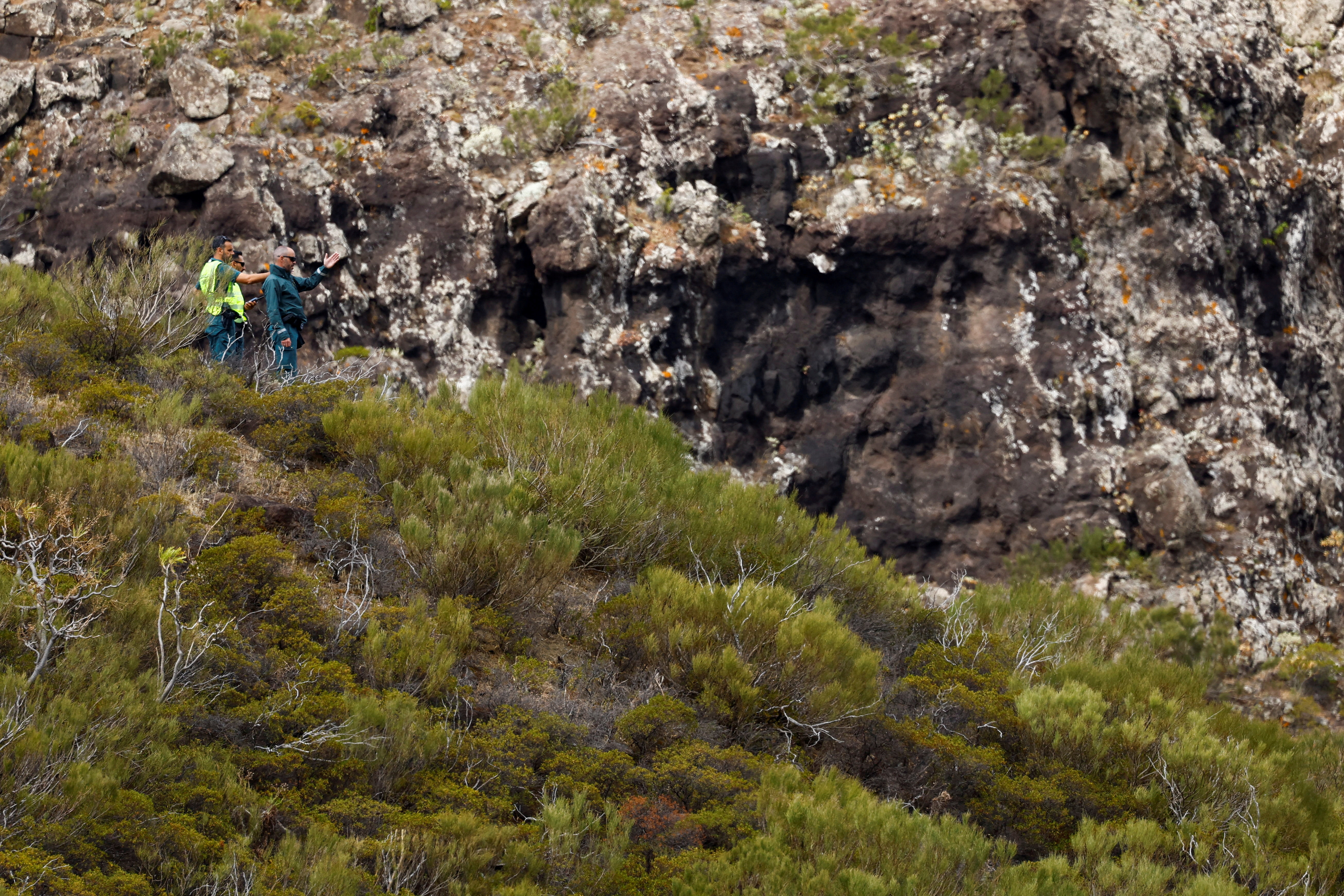 Police officers search for a missing Jay in the Masca ravine