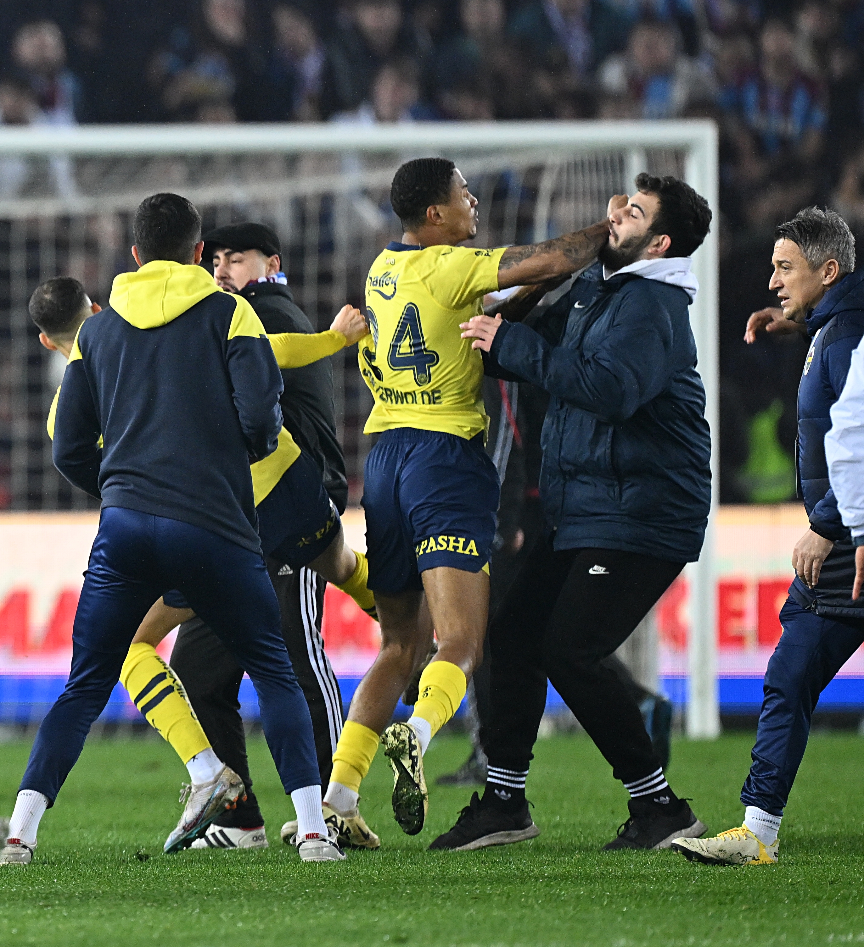 Fenerbahce stars were even seen fighting against rival supporters on the pitch