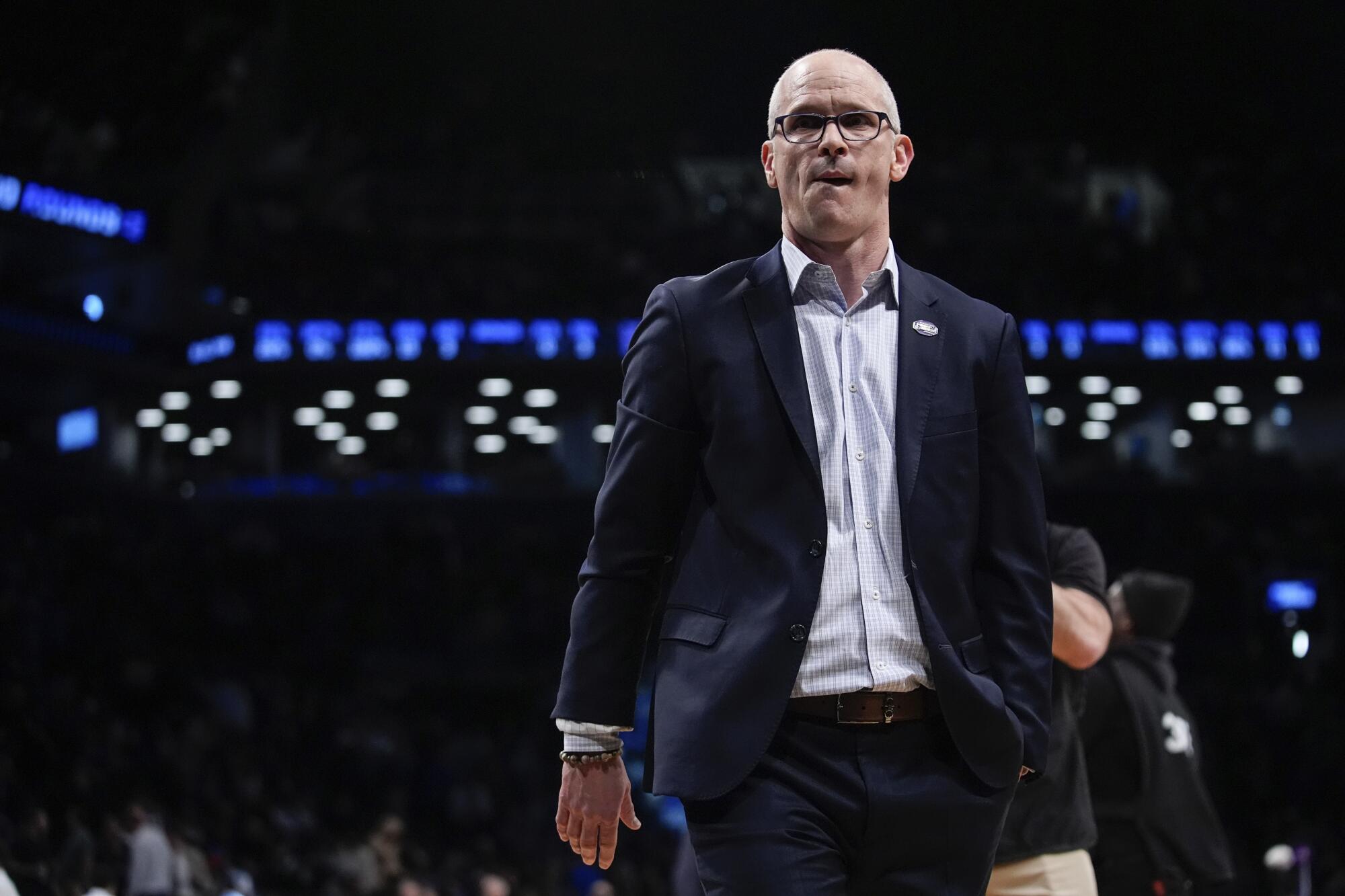 UConn head coach Dan Hurley walks into the locker room at halftime of a second-round.