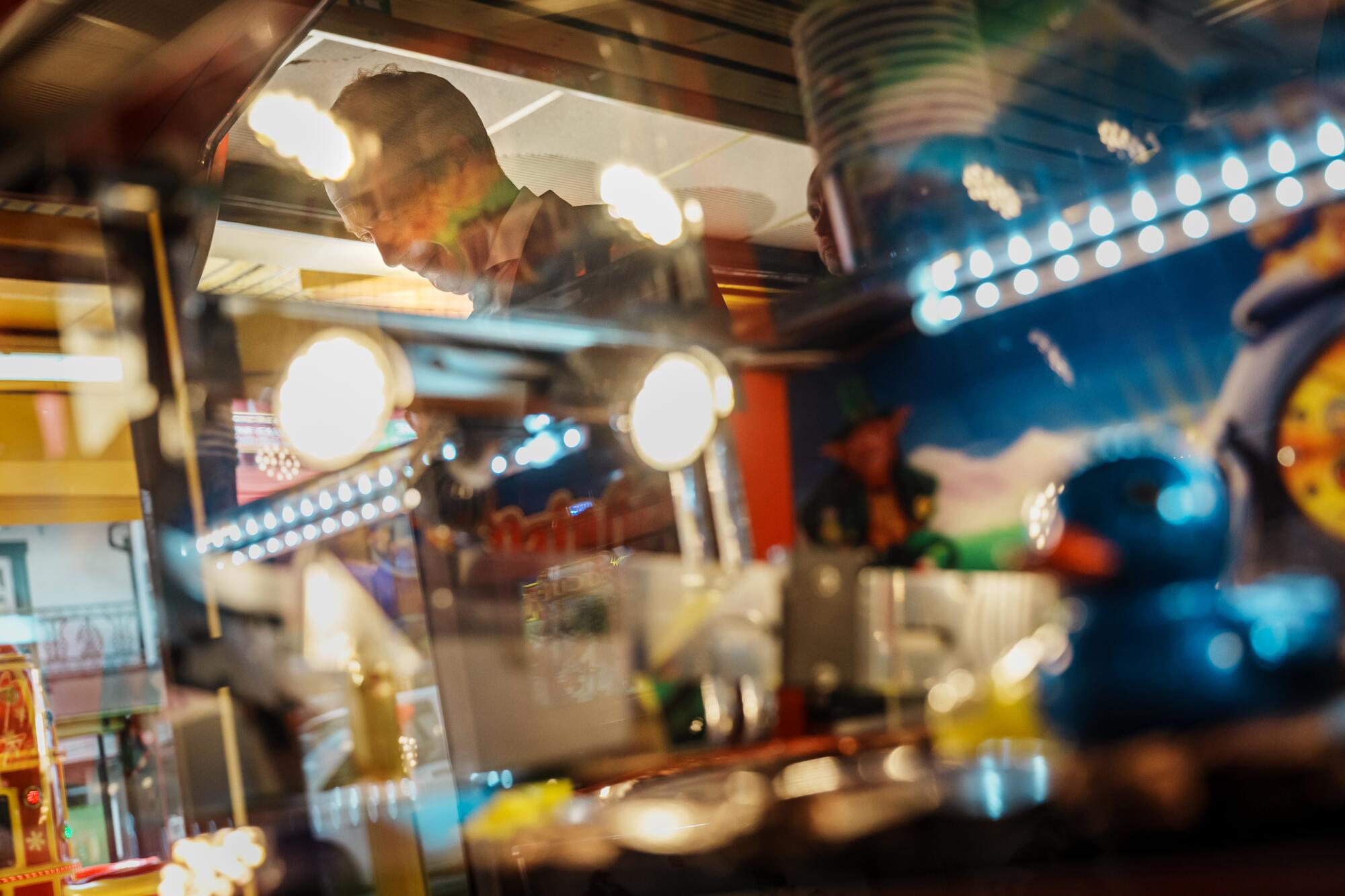  Nigel Farage plays a game at an amusement arcade.