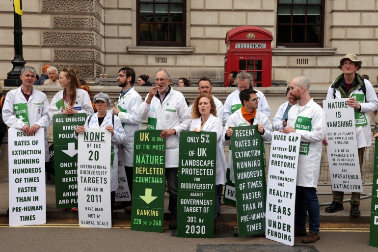 Scientists for Extinction Rebellion line up at 'The Big One' environment event which coincides with "Earth Day", in London, Britain, April 22, 2023. REUTERS/Kevin Coombs